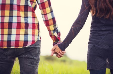 Couple holding hands