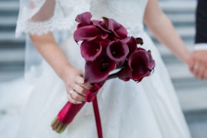 Bridal bouquet of burgundy calla lilies