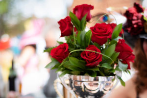 Romantic red roses in a silver dish for event centerpiece