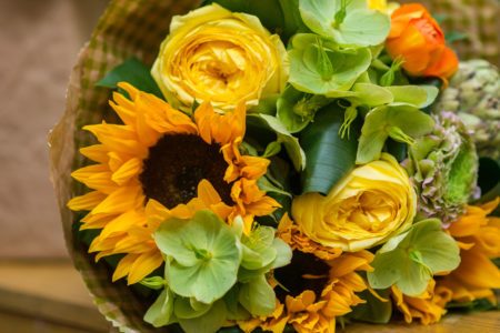 Yellow autumn bouquet with sunflowers and roses